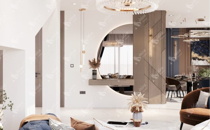 Modern living room with circular mirror, pendant lights, and stylish furniture.